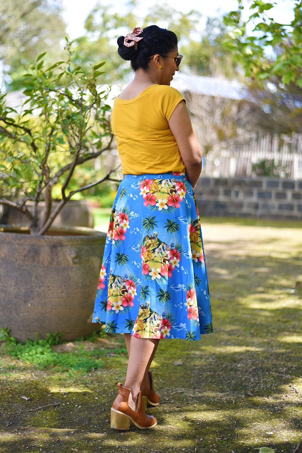 Cooked Hawaiian Wraparound Skirt - Cooked Concepts (Cooked Hawaiian Shirt - Cooked Concepts Commemorate when serial coloniser Captain Cook tried to get fresh with the Native Hawaiians on Valentines Day 1779 and met his grisly end. Cooked Concepts-designed fabric and beautifully made by hand, these skirts, inspired by an Alfred Shaheen design are the softest pure cotton. Josie has paired the Cooked Skirt with a mustard yellow tee (not by us).
