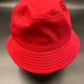 Bucket of Anxiety: Cherry red heavy cotton bucket hat with neutral coloured embroidery across the front reading ANXIOUS. Has an internal sweatband and lines sewed across the brim. 