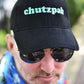 Cap Off Your Chutzpah - Cooked Concepts (Full of chutzpah? This is the cap for you. Black, pure, thick, brushed cotton cap with five eyelets, putting your cojones on display. Bottle green embroidery reads CHUTZPAH. One size fits most, velcro fastening at the back for those less dextrous among us. Be sure to check your size before purchasing!)