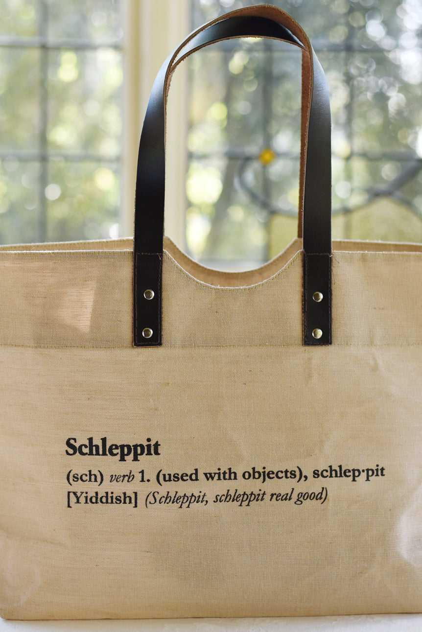 Need something to schlep your stuff around? This is it. Cooked Concepts' Schleppit (v) Tote is made ethically in India from sustainable Jute, features leather straps and metal rivets. 